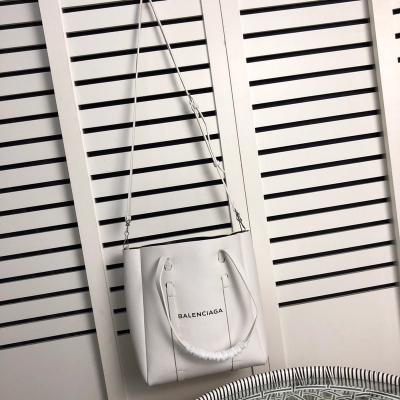 Styled lifestyle shot of modern refined women's handbag – women's statement bag