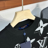 Flat lay presentation of Louis Vuitton luxury clothing with monogram-inspired silhouette