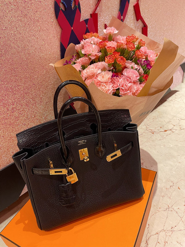 Side view of poised structured handbag