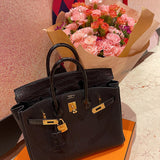 Side view of poised structured handbag