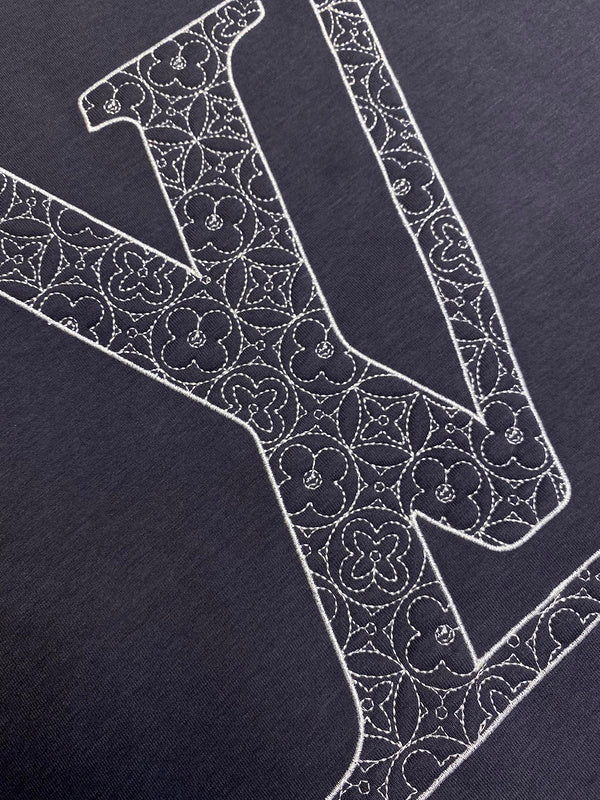 Close-up detail shot of Louis Vuitton luxury clothing with runway-inspired design