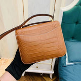 Side view of refined structured handbag