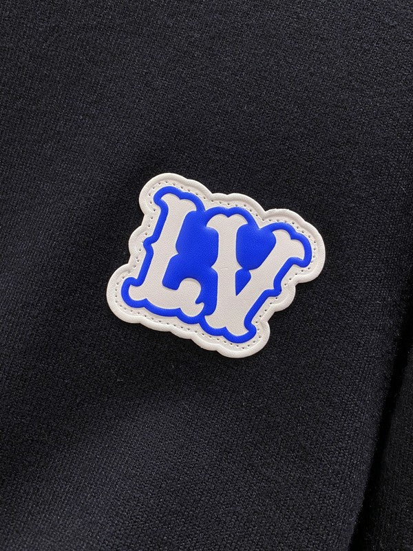Flat lay presentation of Louis Vuitton luxury clothing with streetwear-inspired cut