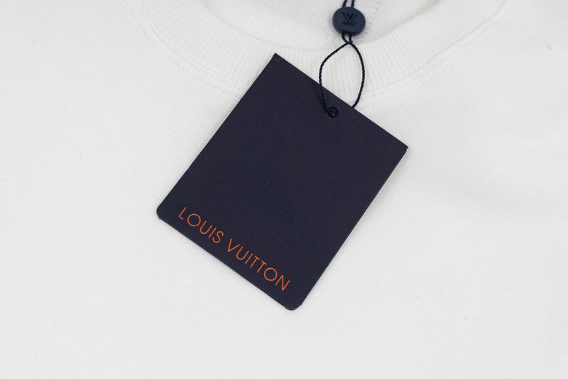 Full styled look of Louis Vuitton luxury clothing with label-forward styling