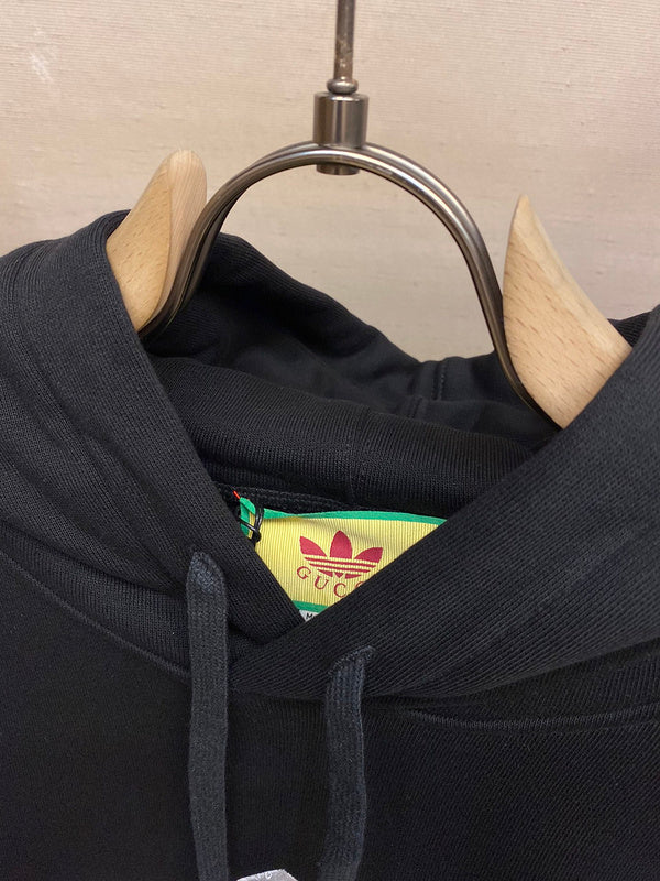 Close-up detail shot of Gucci luxury clothing with label-forward styling