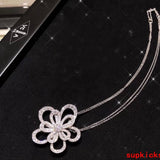 Lifestyle view of Van Cleef & Arpels unisex jewelry piece