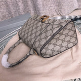 Styled lifestyle shot of signature refined women's handbag – women's premium purse