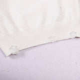 Side profile of Louis Vuitton luxury clothing with label-forward styling