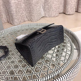 Handle and strap detail of refined signature women's handbag – women's designer-style accessory
