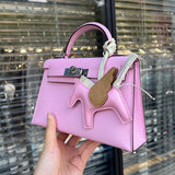 Side view of poised structured handbag