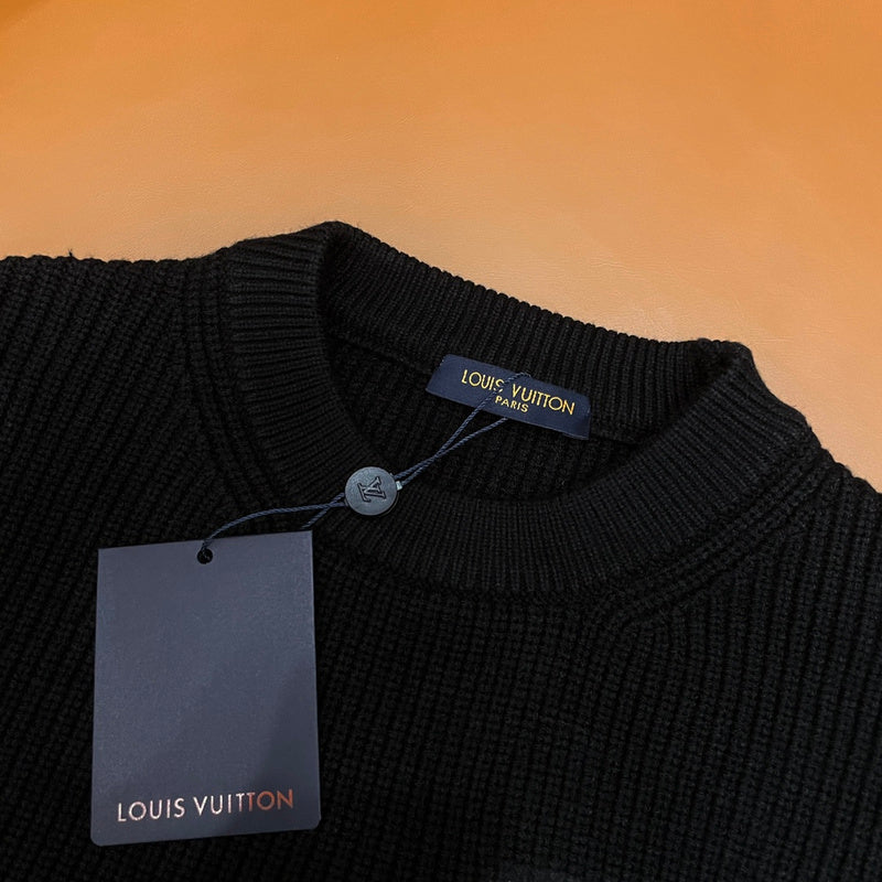 Close-up detail shot of Louis Vuitton luxury clothing with monogram-inspired silhouette