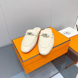 Hermès White Flat Thong Sandals - Angled View
