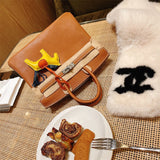 Side view of refined structured handbag