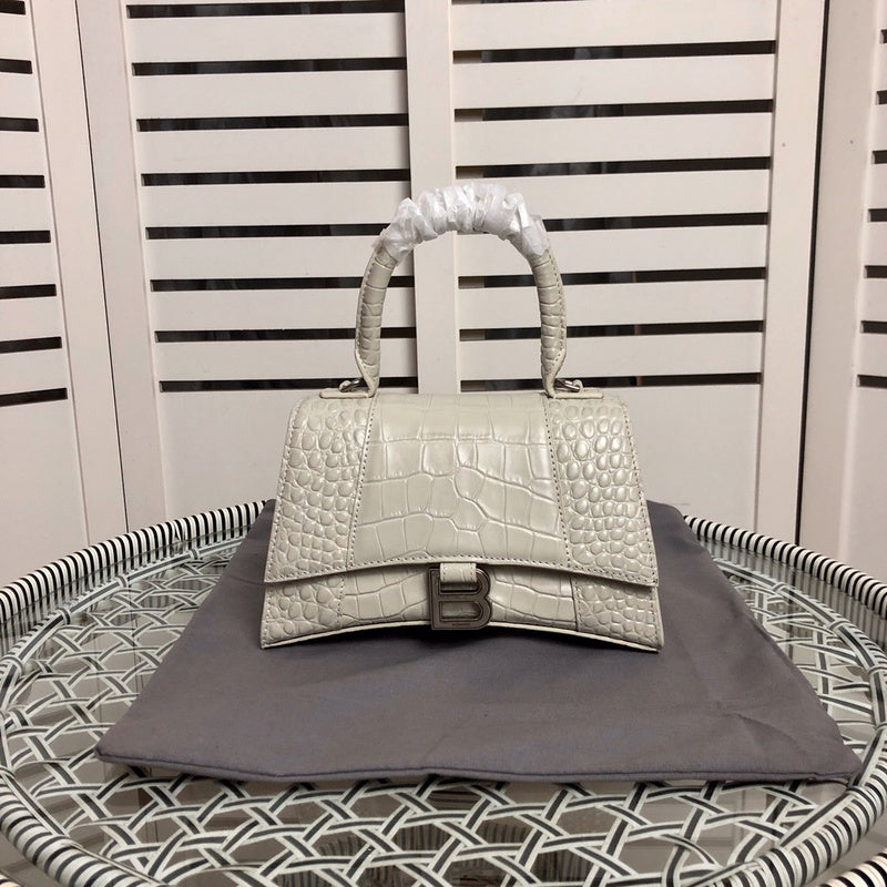 Front view of modern polished women's handbag – women's designer-style accessory