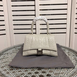 Front view of modern polished women's handbag – women's designer-style accessory