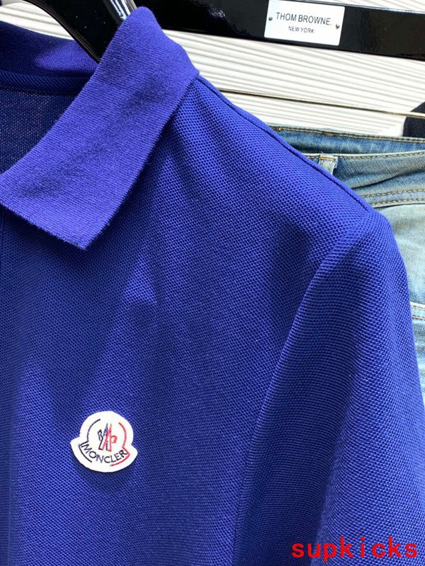 Full styled look of Moncler luxury clothing with signature branding