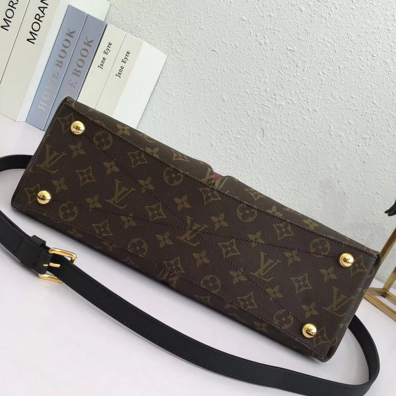 Styled lifestyle shot of statement modern women's handbag – women's luxury handbag