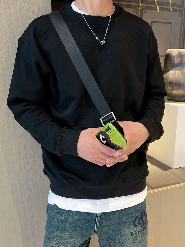 Flat lay presentation of Louis Vuitton luxury clothing with relaxed-fit cut