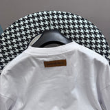 Close-up detail shot of Louis Vuitton cotton t-shirt with monogram-inspired silhouette