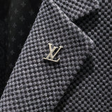 Flat lay presentation of Louis Vuitton luxury clothing with relaxed-fit cut
