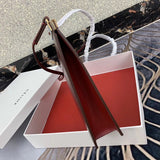 Styled lifestyle shot of statement premium women's handbag – women's designer-style accessory