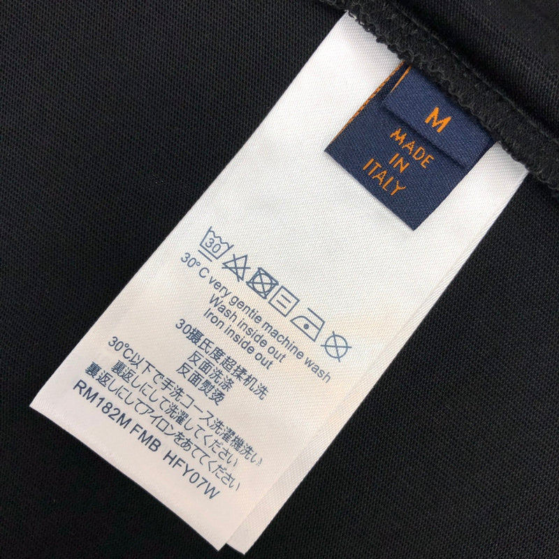 Flat lay presentation of Louis Vuitton cotton t-shirt with label-forward styling