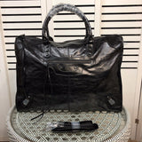 Front view of polished elevated women's handbag – women's statement bag
