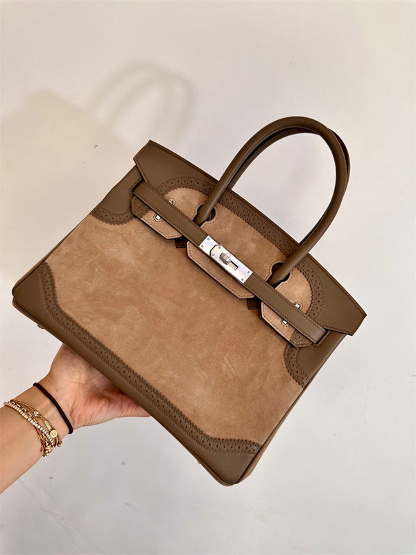  polished top-handle bag detail view showing craftsmanship 8