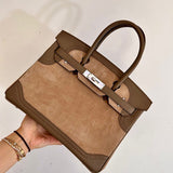  polished top-handle bag detail view showing craftsmanship 8