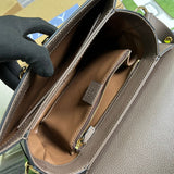 Close-up detail of polished classic women's handbag – women's statement bag