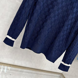 Back view of Louis Vuitton luxury clothing with signature branding