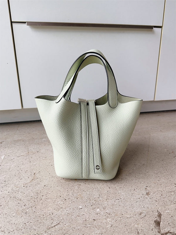 Structured crossbody bag carried on shoulder