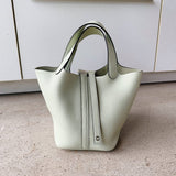  Structured crossbody bag carried on shoulder