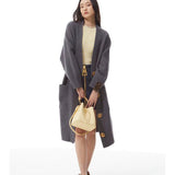  Signature handbag carried on shoulder
