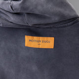 Side profile of Louis Vuitton luxury clothing with tailored silhouette