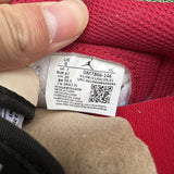 Side profile of Nike soft grey sneakers classic court silhouette
