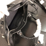 Close-up detail of elevated polished women's handbag – women's luxury accessory