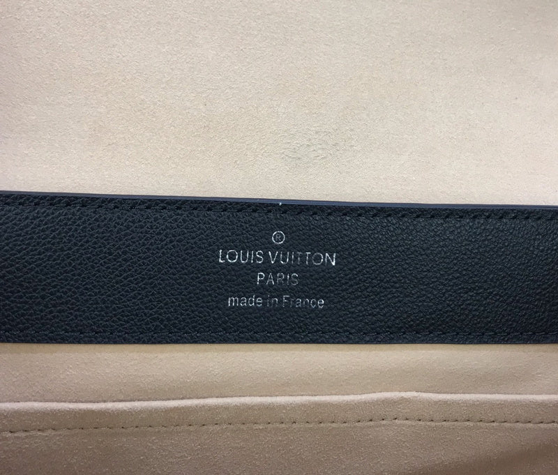 Side profile of polished signature women's handbag – women's designer-style accessory