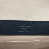 Side profile of polished signature women's handbag – women's designer-style accessory