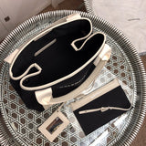 Styled lifestyle shot of modern sleek women's handbag – women's designer-style accessory