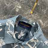 Close-up detail shot of Louis Vuitton luxury clothing with label-forward styling