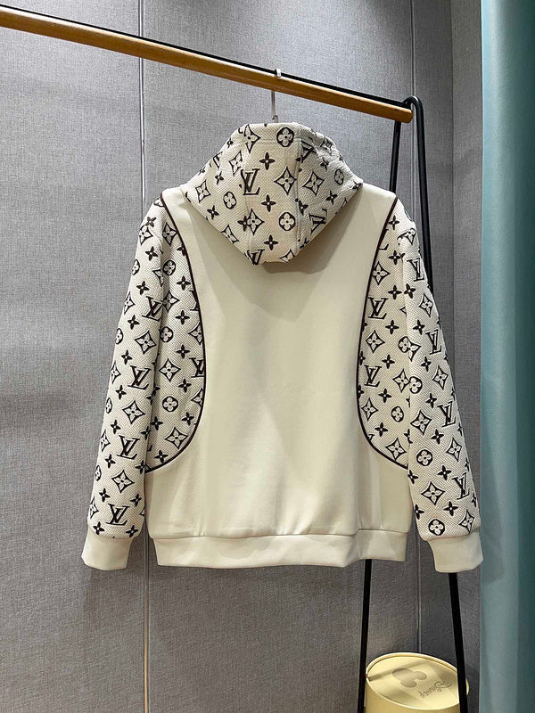 Flat lay presentation of Louis Vuitton luxury clothing with tailored silhouette
