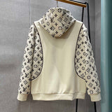 Flat lay presentation of Louis Vuitton luxury clothing with tailored silhouette