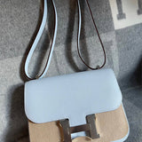 Side view of curated structured handbag