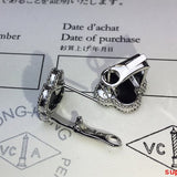 Angled view of Van Cleef & Arpels unisex jewelry piece