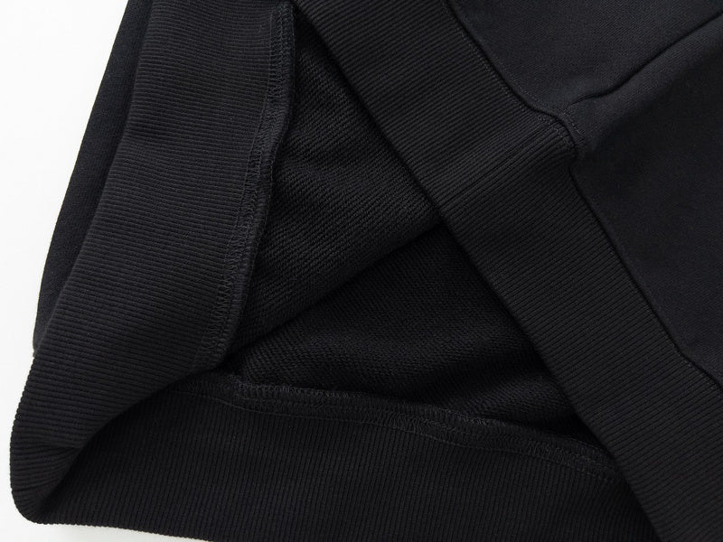 Close-up detail shot of Louis Vuitton luxury clothing with signature branding