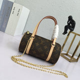 Side profile of polished signature women's handbag – women's luxury accessory