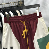 Close-up detail shot of Rhude luxury clothing with streetwear-inspired cut