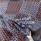Front view of Louis Vuitton luxury clothing with label-forward styling