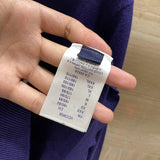 Close-up detail shot of Louis Vuitton luxury clothing with runway-inspired design